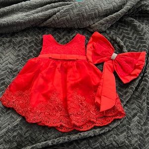 Beautiful red dress with matching pin bow.